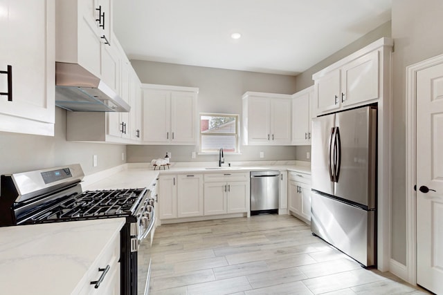 706 Poinsettia Dr, Lancaster, TX 75146 - kitchen featuring stainless steel appliances, range hood, light stone countertops, white cabinetry, and recessed lighting