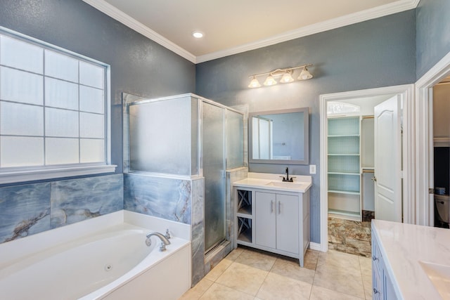 bathroom with vanity, a whirlpool tub, crown molding, a stall shower, and a walk in closet