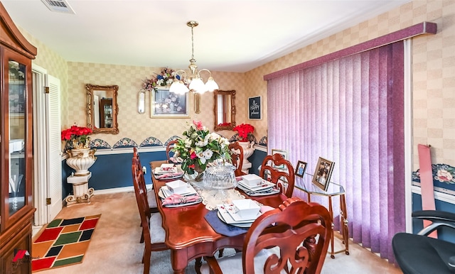 dining space with visible vents, a chandelier, wallpapered walls, baseboards, and carpet