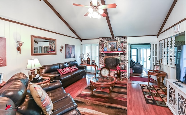 living room with high vaulted ceiling, wood finished floors, a ceiling fan, and plenty of natural light