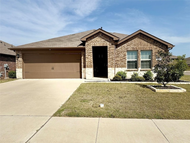 ranch-style home with a shingled roof, an attached garage, a front lawn, brick siding, and driveway