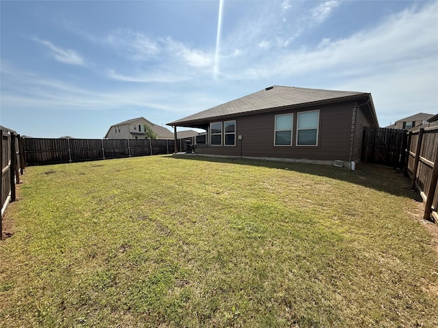 view of yard with a fenced backyard