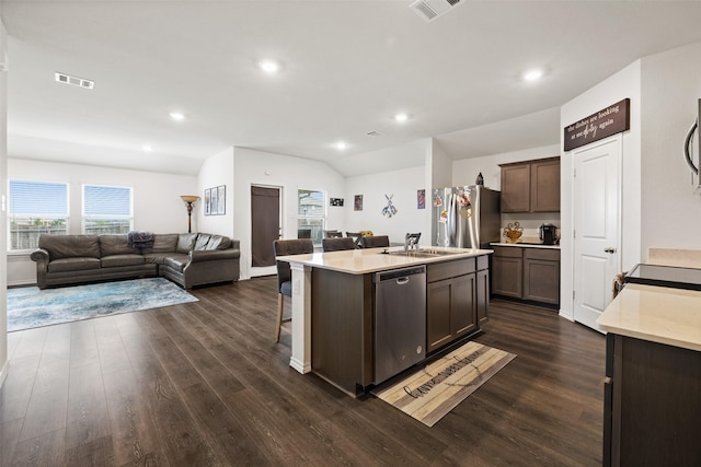 2802 Elk Rd, Crandall, TX 75114 - kitchen featuring appliances with stainless steel finishes, open floor plan, light countertops, dark wood finished floors, and recessed lighting