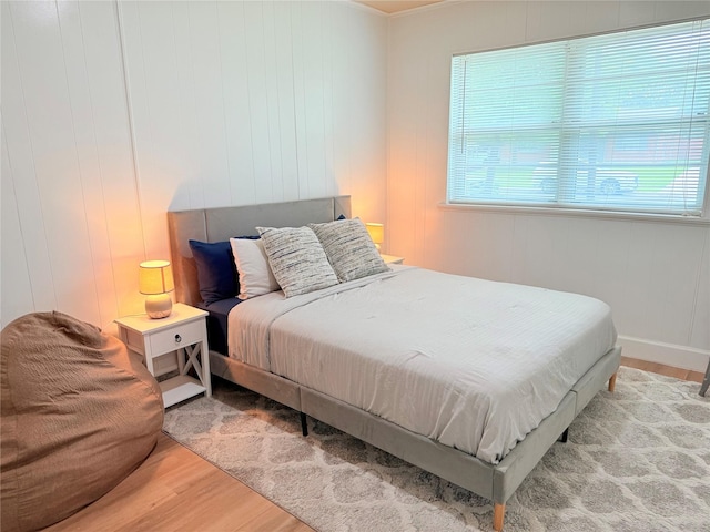bedroom with wood finished floors