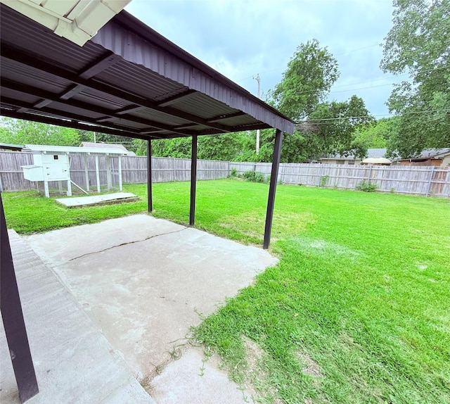 view of patio / terrace with exterior structure and a fenced backyard