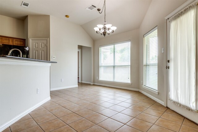 unfurnished dining area with a notable chandelier, light tile patterned flooring, and visible vents