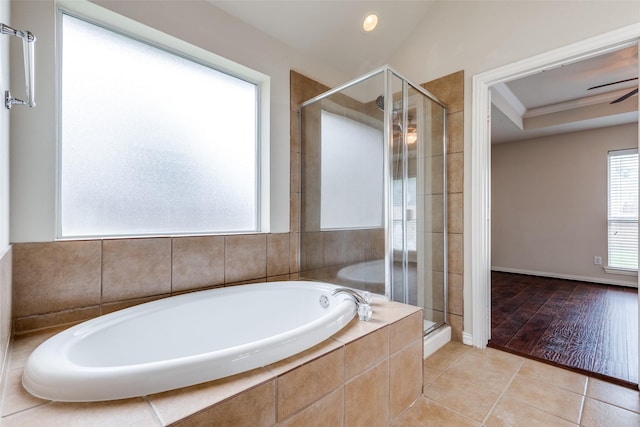 bathroom with tile patterned floors, a shower stall, and a garden tub