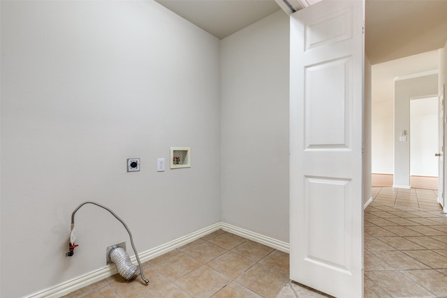 laundry area featuring light tile patterned flooring, washer hookup, laundry area, baseboards, and hookup for an electric dryer