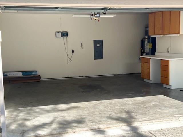 garage with water heater and electric panel