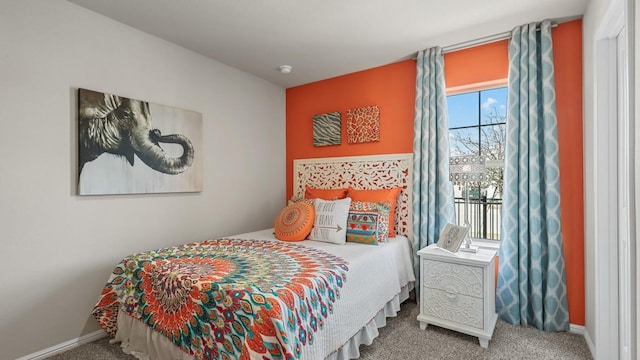 bedroom with baseboards and carpet flooring