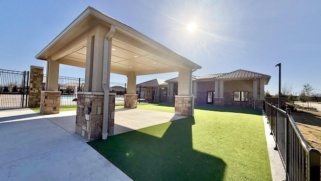 exterior space with a patio and fence
