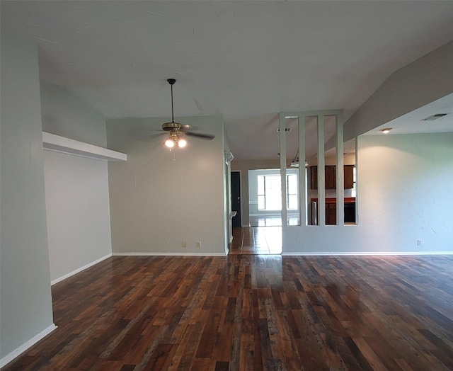 unfurnished living room with ceiling fan, hardwood / wood-style flooring, and baseboards
