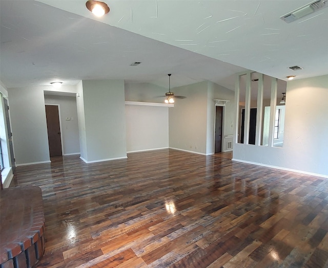 unfurnished living room featuring visible vents, ceiling fan, wood finished floors, and baseboards