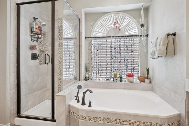 3001 Quail Holw, Mckinney, TX 75072 - full bathroom with a garden tub, a stall shower, and healthy amount of natural light