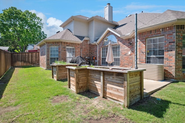 3001 Quail Holw, Mckinney, TX 75072 - back of property with brick siding, a chimney, and a shingled roof