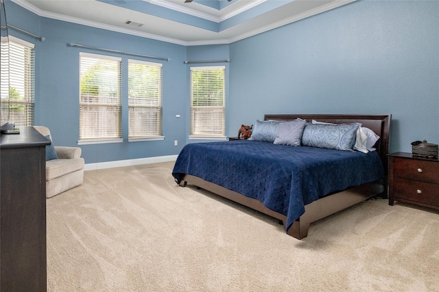 carpeted bedroom with ornamental molding, visible vents, and baseboards
