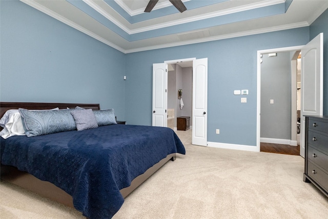 bedroom featuring connected bathroom, crown molding, a ceiling fan, light carpet, and baseboards