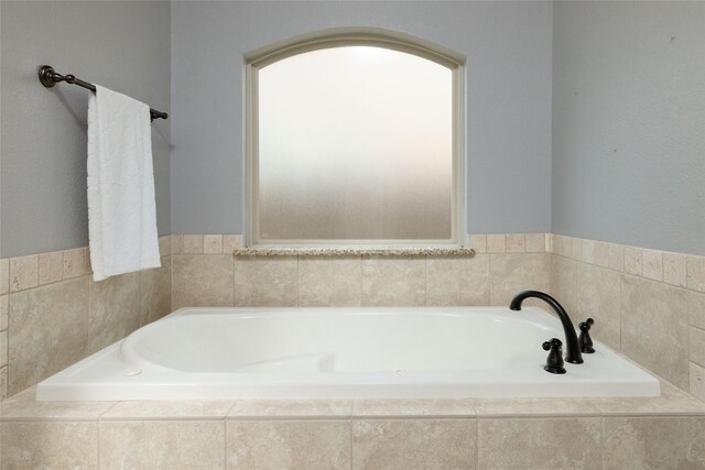 full bath with a garden tub
