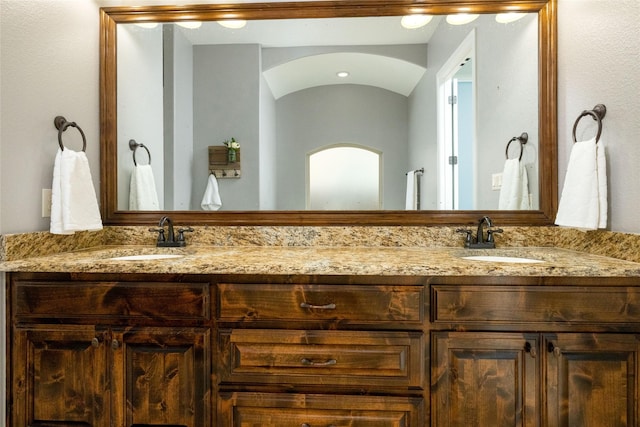 bathroom with double vanity and a sink