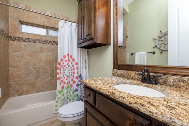 bathroom with shower / tub combo, vanity, and toilet