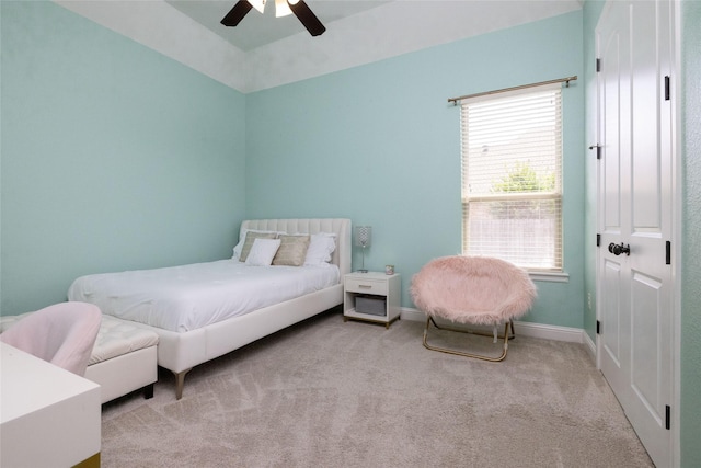 bedroom featuring baseboards, ceiling fan, and carpet