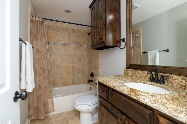 full bathroom with tile patterned floors, shower / bath combo with shower curtain, toilet, and vanity