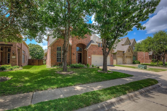 3509 New Castle Ct, Richardson, TX 75082 - view of front facade with concrete driveway, fence, brick siding, a front lawn, and a garage