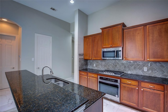 3509 New Castle Ct, Richardson, TX 75082 - kitchen with a sink, stainless steel appliances, marble finish floor, visible vents, and backsplash