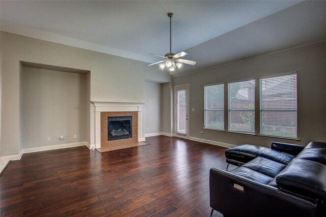 3509 New Castle Ct, Richardson, TX 75082 - living room with wood finished floors, a tile fireplace, ceiling fan, baseboards, and lofted ceiling