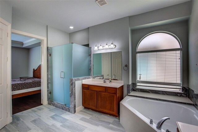3509 New Castle Ct, Richardson, TX 75082 - full bath featuring a shower stall, ensuite bathroom, vanity, visible vents, and a garden tub