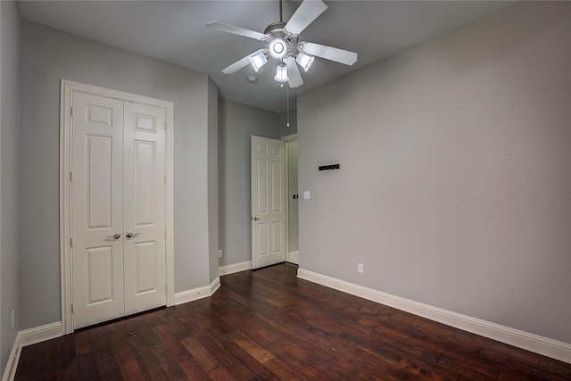 3509 New Castle Ct, Richardson, TX 75082 - unfurnished bedroom with baseboards, a ceiling fan, a closet, and dark wood-type flooring