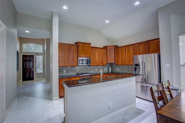 3509 New Castle Ct, Richardson, TX 75082 - kitchen featuring appliances with stainless steel finishes, brown cabinets, marble finish floor, baseboards, and a center island with sink