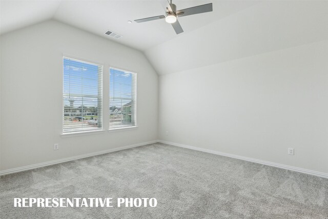 bonus room featuring visible vents, carpet flooring, and vaulted ceiling