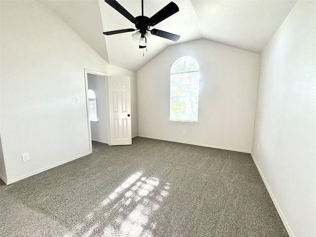 unfurnished bedroom featuring baseboards, vaulted ceiling, ceiling fan, and carpet