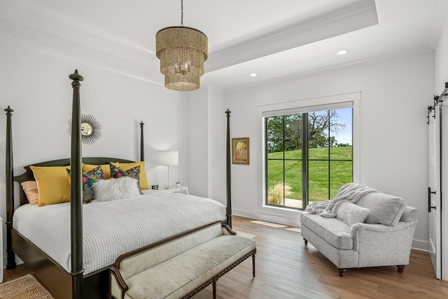 bedroom with crown molding, recessed lighting, light wood-style flooring, and a chandelier