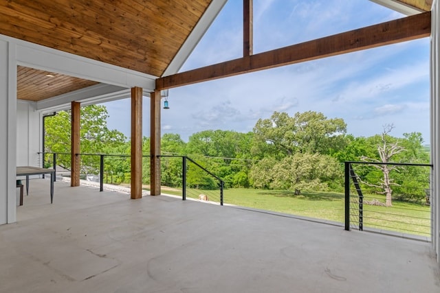 view of patio / terrace featuring a view of trees