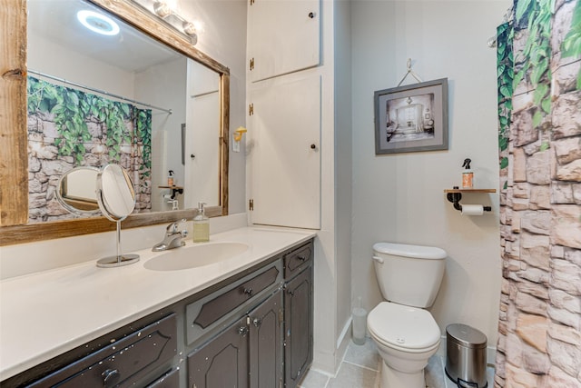 bathroom with vanity, tile patterned floors, and toilet
