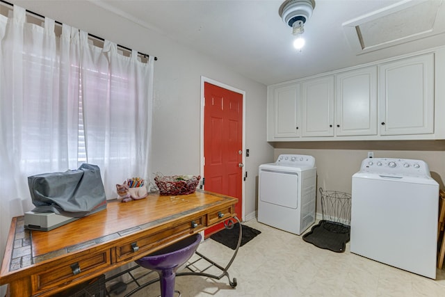 washroom with cabinet space, washer and clothes dryer, and light floors