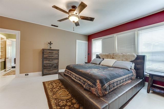 bedroom featuring baseboards, a ceiling fan, and visible vents