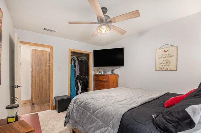 bedroom featuring baseboards, ceiling fan, and light colored carpet