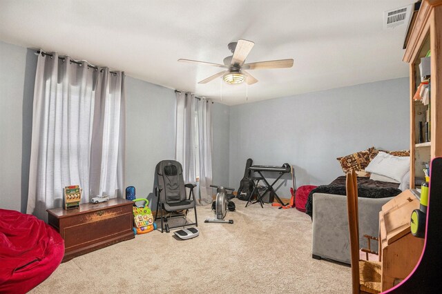 bedroom featuring visible vents, a ceiling fan, and a closet