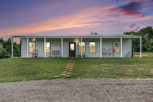 view of front of property with board and batten siding and a front yard