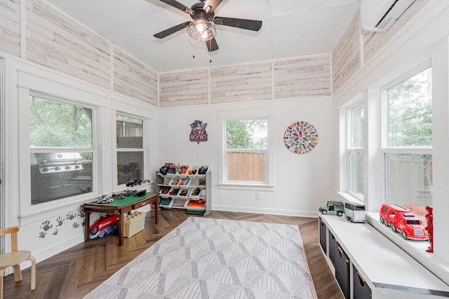 680 Alexandrite Dr, Oak Point, TX 75068 - game room featuring a wall mounted AC, baseboards, ceiling fan, and a high ceiling