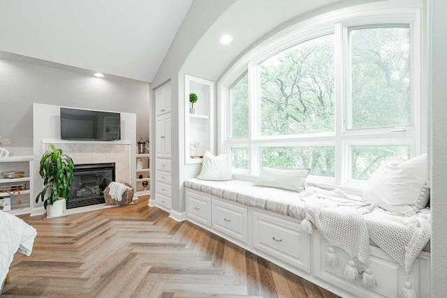 680 Alexandrite Dr, Oak Point, TX 75068 - bedroom featuring a tiled fireplace, lofted ceiling, and recessed lighting