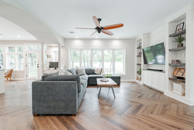 680 Alexandrite Dr, Oak Point, TX 75068 - living room with a ceiling fan, plenty of natural light, arched walkways, baseboards, and recessed lighting
