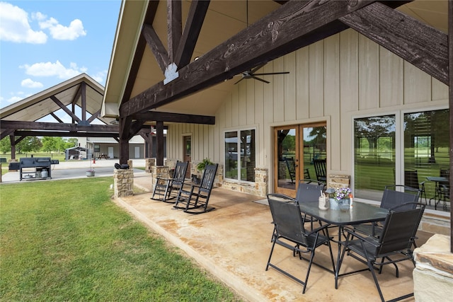 view of patio / terrace with a gazebo, a ceiling fan, and outdoor dining space