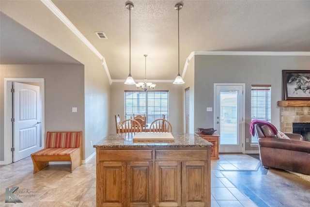 102 Wait Station Ave, Tuscola, TX 79562 - kitchen featuring crown molding, a chandelier, light tile patterned floors, stone countertops, and open floor plan
