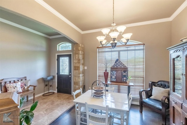 102 Wait Station Ave, Tuscola, TX 79562 - dining room featuring a chandelier, arched walkways, ornamental molding, and baseboards