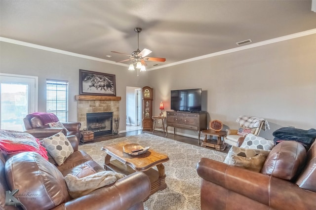 102 Wait Station Ave, Tuscola, TX 79562 - living room featuring crown molding, ceiling fan, and a fireplace with flush hearth