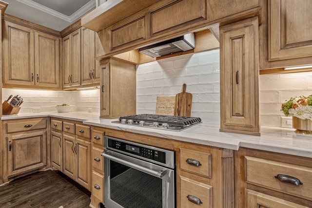 kitchen with crown molding, decorative backsplash, stainless steel appliances, and dark wood-style floors